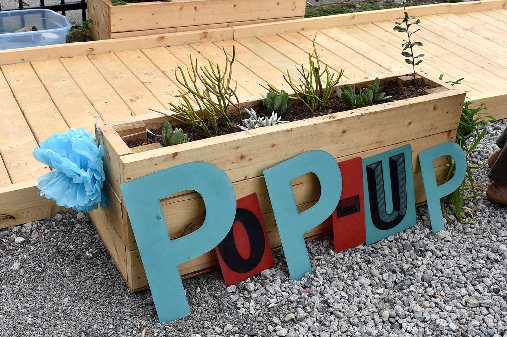 A new, temporary Pop-up Park gave Renton residents visiting the local farmers market a place to rest, or play, for a short-time.                                Photo by Haley Ausbun.