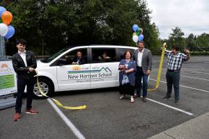 Photo by Haley Ausbun. Photo left to right: David Rodriguez, Tony Ventrella, Rachel Chronister, Marla Veliz, Reagan Dunn, and Gavin Hunt at the Sept. 10 ribbon cutting for the New Horizon School van, gifted by King County Councilmember Reagan Dunn through the retired van program.