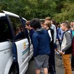 Photo by Haley Ausbun. At the Sept. 10 ribbon cutting, New Horizon School students get to check out their new van, gifted by King County Councilmember Reagan Dunn through the retired van program.