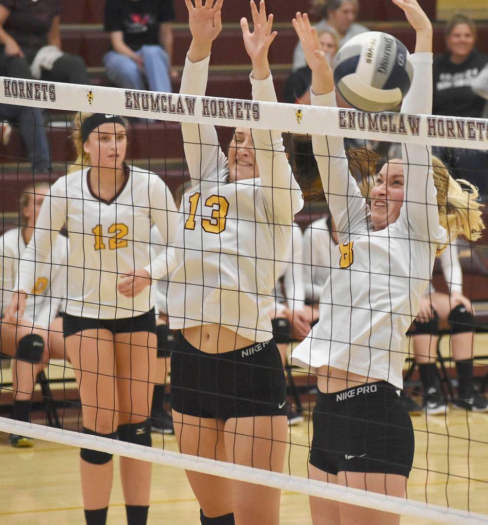 The Hazen team attempted to block at the net during an away game against Enumclaw on Thursday, Sept. 19. Photo by Kevin Hanson