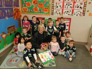 Photo courtesy of Shooting Star Preschool and Childcare. Sen. Patty Murray (D-WA) with tots in the Renton Highlands after being presented with a song and big welcome card.