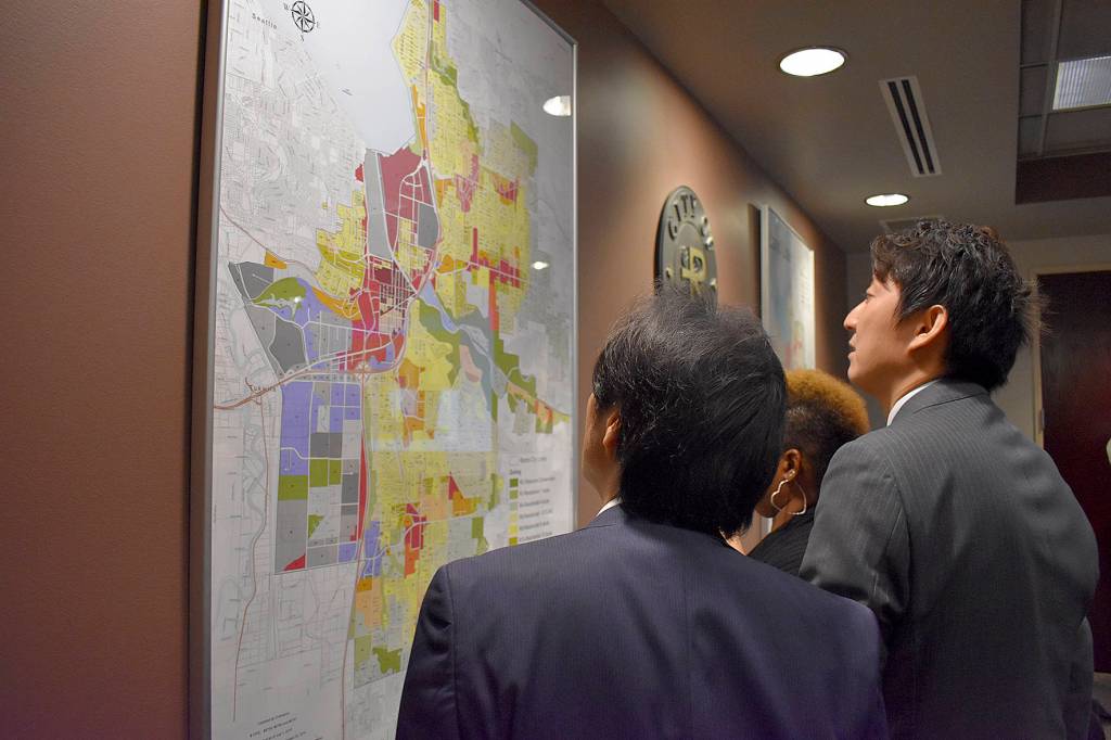 Photo by Haley Ausbun. Nishiwaki delegates look at a map of Renton during the Oct. 17 ceremony lunch break.