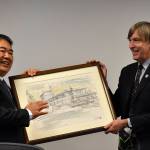 Photo by Haley Ausbun. Chairman of the Nishiwaki City Council Harunobu Hayashi offering a gift to Renton Councilmember Randy Corman.