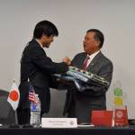 Photo by Haley Ausbun. Nishiwaki Mayor Shozo Katayama presents a gift to Mayor Denis Law for the city of Renton.