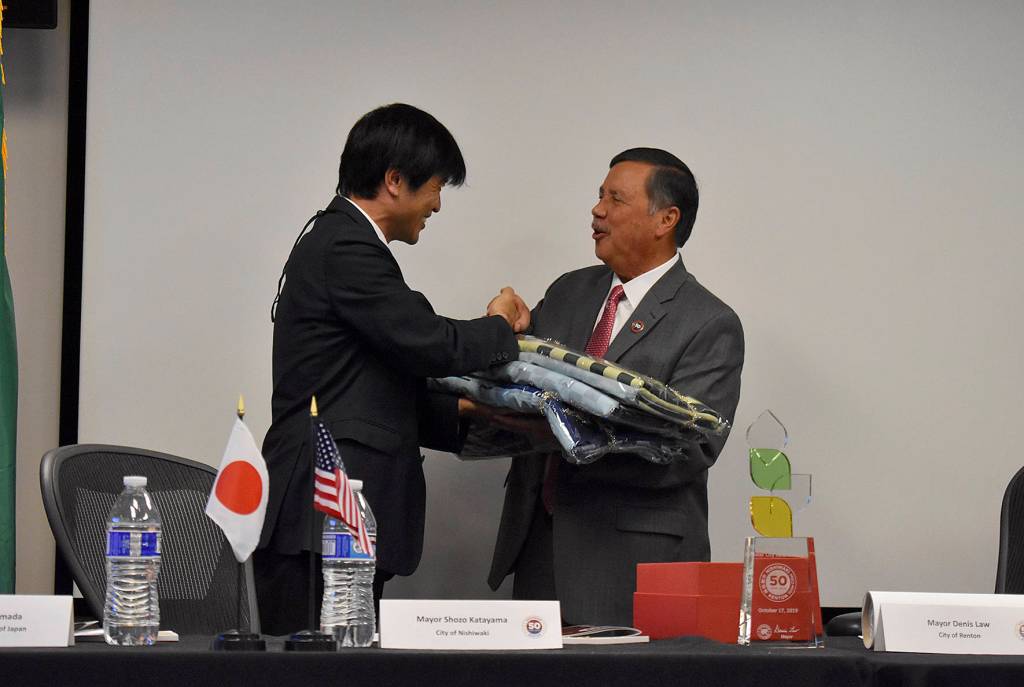Photo by Haley Ausbun. Nishiwaki Mayor Shozo Katayama presents a gift to Mayor Denis Law for the city of Renton.