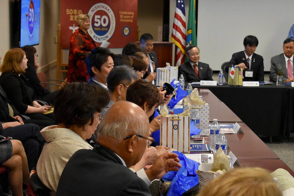 Photo by Haley Ausbun. Nishiwaki delegates look at gifts from city of Renton.