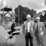 Photo courtesy of King County. From left facing to right, Renton City Councilmember Armondo Pavone, King County Councilmember Reagan Dunn, Renton Public Works Administrator Gregg Zimmerman, and Renton Public Works staff member Joe Farah listen to a briefing on work at the Black River Pump Station during a recent tour.