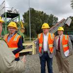 Photo courtesy of King County. From left facing to right, Renton City Councilmember Armondo Pavone, King County Councilmember Reagan Dunn, Renton Public Works Administrator Gregg Zimmerman, and Renton Public Works staff member Joe Farah listen to a briefing on work at the Black River Pump Station during a recent tour.