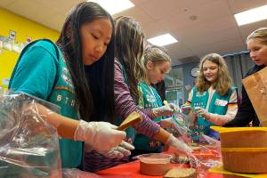 Photo by Haley Ausbun. Girl Scouts from troops 46754, 41126 and 41170 put together 400 sandwhich lunches on Saturday, Nov. 9 as part of Vision House kids serve event. The lunches then went to people experiencing homelessness in Seattle via Union Gospel Mission Search and Rescue.