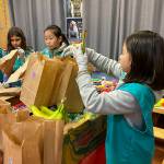 Photo by Haley Ausbun. Girl Scouts from troops 46754, 41126 and 41170 put together 400 sandwhich lunches on Saturday, Nov. 9 as part of Vision House kids serve event. The lunches then went to people experiencing homelessness in Seattle via Union Gospel Mission Search and Rescue.