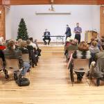 Photo courtesy Brennan Bunn. Rob Gannon, General Manager of King County Metro Transit, and Peter Rogoff, CEO of Sound Transit, and King County Councilmember Dave Upthegrove onstage at the Transit Town Hall, Dec. 4, at Renton Senior Activity Center.