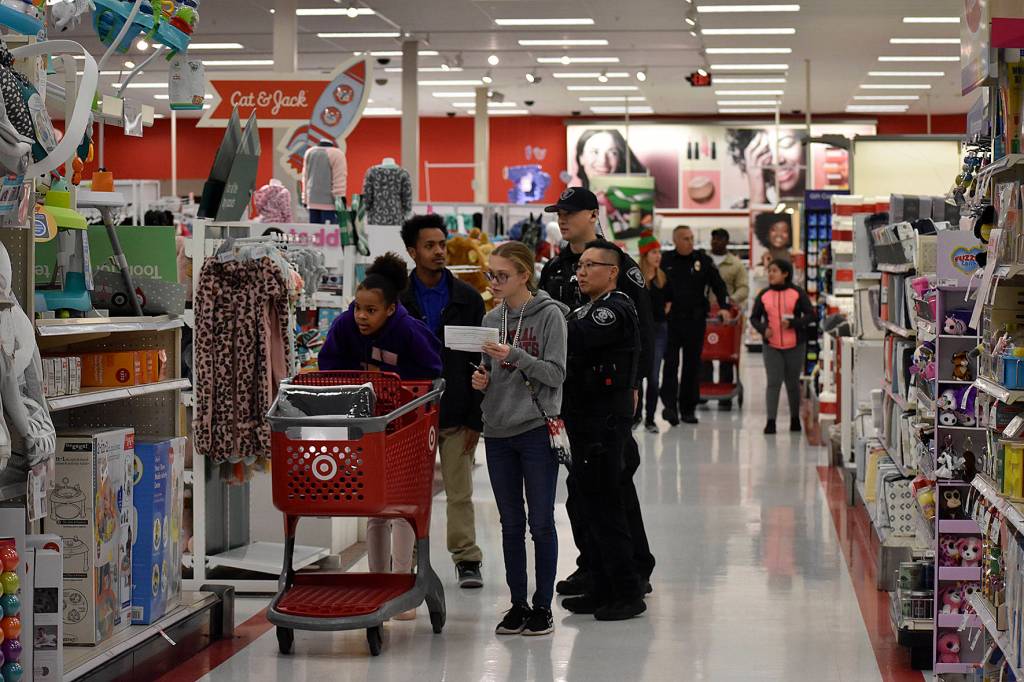 Photo by Haley Ausbun. On Saturday, Dec. 14, 15 students were paired with Renton Police Department officers who volunteered their mornings to each kids family wish list at 2019 Shop with a Cop.