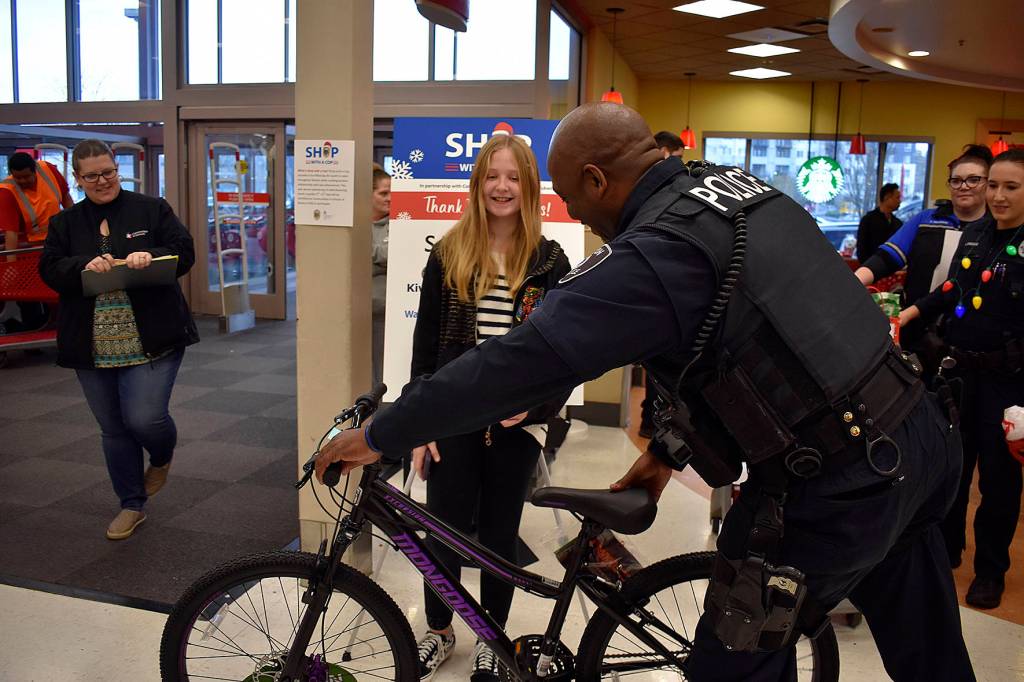 Photo by Haley Ausbun. On Saturday, Dec. 14, 15 students were paired with Renton Police Department officers who volunteered their mornings to each kids family wish list at 2019 Shop with a Cop.