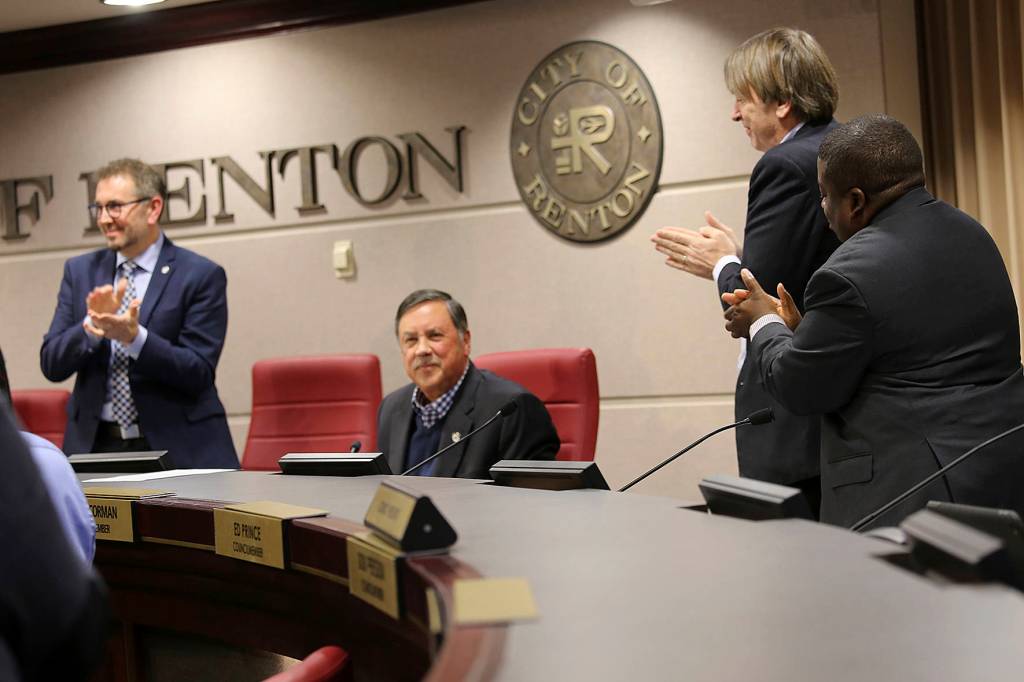 Photo courtesy of city of Renton. Mayor Denis Law receives standing applause at his final council meeting.