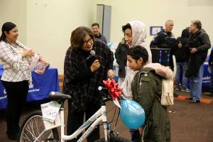 Photo courtesy of city of Renton. Council President Ruth Pérez speaks at Centro Rendu de San Vicente de Paul for the Reyes Magos event.