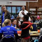 Photo by Haley Ausbun. In the Lindbergh High School library, United Way volunteers watched kids and small children while their parents talked to housing assistance providers at the Family Resource Exchange event on Martin Luther King Jr. Day, Jan. 20.