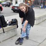 Alexander, who attended the event with his family that are currently housed at Marys Place, shows off his new shoes, compared to the pair hes had the last two years. The shoes were just one of the resources his family accessed at the United Way Family Resource Exchange on Martin Luther King Jr. Day, Jan. 20 at Lindbergh High School.