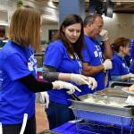 Photo by Haley Ausbun. Not the normal lunchroom crowd at Lindbergh: Volunteers, including Family First Community Center founder and former Seahawk Doug Baldwin, served attendees a buffet lunch at the United Way Family Resource Exchange on Martin Luther King Jr. Day, Jan. 20 at Lindbergh High School.