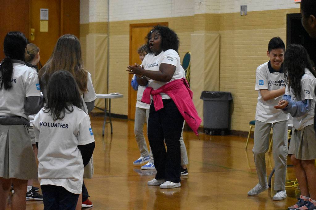 Photo by Haley Ausbun. On Jan.22 about 60 St. Anthonys students put together gift bags with school supplies for their sister school in Haiti, with the help of the WE and NFL Huddle for Good initiative. We Ambassador Dr. J flew in from California to get the students excited for a day of volunteering.