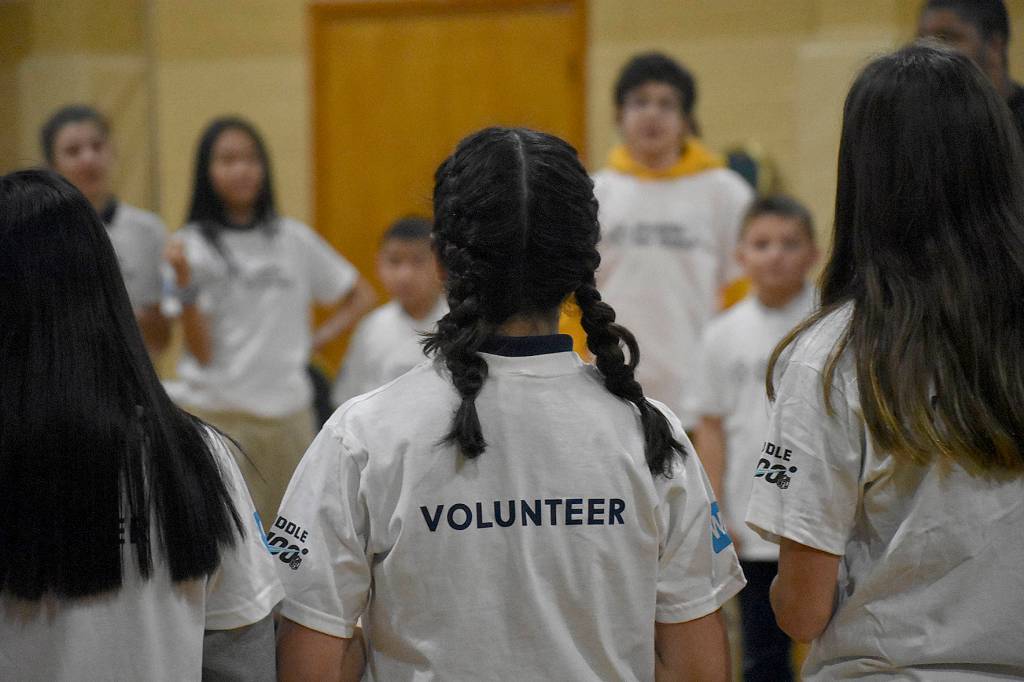 Photo by Haley Ausbun. On Jan.22 about 60 St. Anthonys students put together gift bags with school supplies for their sister school in Haiti, with the help of the WE and NFL Huddle for Good initiative. The schools connected after the devastating earthquake in Haiti killed a young missionary connected to the parish in Renton.
