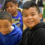 Photo by Haley Ausbun. Eli, a second grader, was working with the help of fellow students to complete an electrical circuit that was meant to turn on a light bulb. The students took several shots at the electrical engineering game, clearly sparking an interest in STEM.