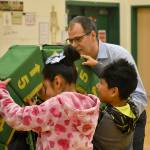 Photo by Haley Ausbun. Pictured: Students at Highlands Elementary School work on an impressive feat of civil engineering, with the help of a representative of the Pacific Science Center (right).
