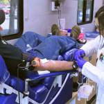 A mobile center from Bloodworks Northwest takes blood from Enumclaw resident Andy Bremmeyer, pictured in this 2019 photo. Sound Publishing file photo