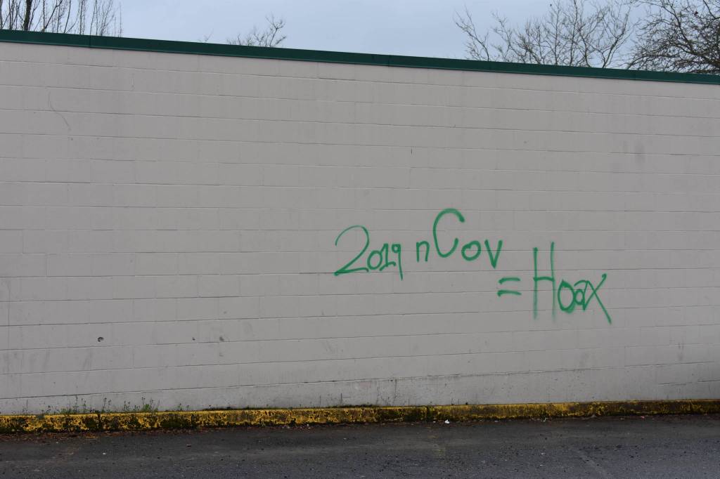 Photo by Haley Ausbun. While public health officials and leaders try to get information out to county residents, confusion and fear continue to spread. Pictured: graffiti in the Renton Sunset neighborhood that reads: 2019 nCov = HoaxKnow of more event cancellations and facility closures in the Renton area due to novel coronavirus? Let the reporter know at hausbun@rentonreporter.com.