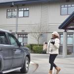 Renton School District employees hand out bagged lunches to families while schools remain shut down during the COVID-19 pandemic on Tuesday, March 17, 2020. Pictured: Campbell Hill Elementary School cook Annette Livingston. Photo by Haley Ausbun.