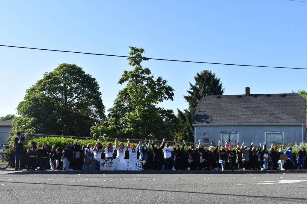 Protesters kneeling in unity across from Renton City Hall, Monday, June 1. Photo by Haley Ausbun.