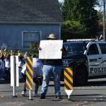 Protesters gathered at Renton City Hall, Monday, June 1. This protesters sign reads: Can I live to be 21 please? Photo by Haley Ausbun.