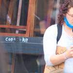 A letter from Mantry Norris mother let it known her son had a mental illness when he was shot and killed by a Renton Police Sergeant nearly a year ago at Cheers Bar. A permanent mark (left) is a bullet hole that went through the table, window and across the street. It was the first officer involved shooting in 10 years. Photo by David Nelson.