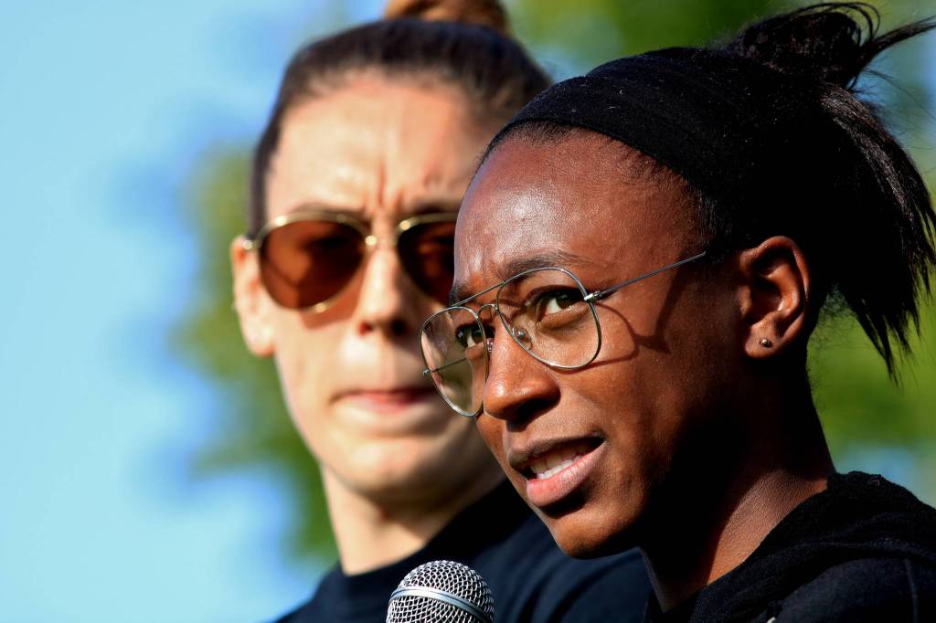 Seattle Storms Jewell Loyd (front) and Breanna Stewart (behind) attend an Our Voice Matters youth/parent forum at Liberty Park on June 4. Use your voice, everyone here matters. Dont be afraid. We hear you and see you, Loyd said. Photo by David Nelson.