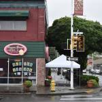 On Monday afternoon, the newer trees around Common Ground Coffee and Cupcakes were already removed but the at-least 13 year old Maple tree remained at an intersection that is being improved for the Wells and Williams two-way conversion project. Photo by Haley Ausbun.
