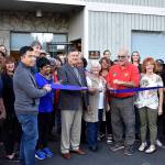 The Renton Kiwanis Clothes Bank celebrates its new location with city and chamber representatives Oct. 16, 2018. Haley Ausbun/ Staff photo.