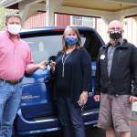 King County Councilmember Reagan Dunn hands the van keys over to Vision House Executive Director Melissa Gehrig.