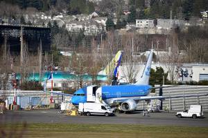 Photo by Haley Ausbun. Boeing employees check on some of the parked MAX planes at the Renton plant where they are assembled, Spring 2019.