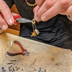 Liz Falconer crafts jewelry in her home (photo credit: Liz Falconer)
