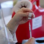 A CVS pharmacist prepares a COVID-19 vaccine at Village Green Retirement Campus in Federal Way on Jan. 26. Olivia Sullivan/Sound Publishing