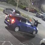 A screenshot from private surveillance footage provided by the Seattle Police Department shows a suspect engaging with the occupants of a vehicle on Feb. 9, 2021, in Seattle. The suspect shot the vehicles two occupants, one fatally, before he was killed by police. File photo
