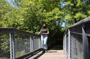 Interpretive guide Shell Michaluk-Bergan stands on boardwalk to Bird Island (photo credit: Cameron Sheppard)