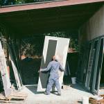 Alexander arranges the panels that will makeup the mural at Liberty Park (photo by Andrew Valentine)