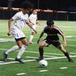 Hazens Hamza Zayan, left, challenges Mercer Islands Nicholas Chou for the ball. Andy Nystrom/ staff photo