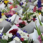 Along with produce, drinks, art and ready-to-eat food, the Renton Farmers Market offers cut flowers. Photo: Bailey Jo Josie/Sound Publishing.