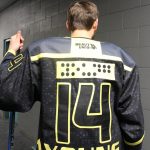 Adam Youngs hockey jersey spells out his name in braille. Photo by Bailey Jo Josie/Sound Publishing