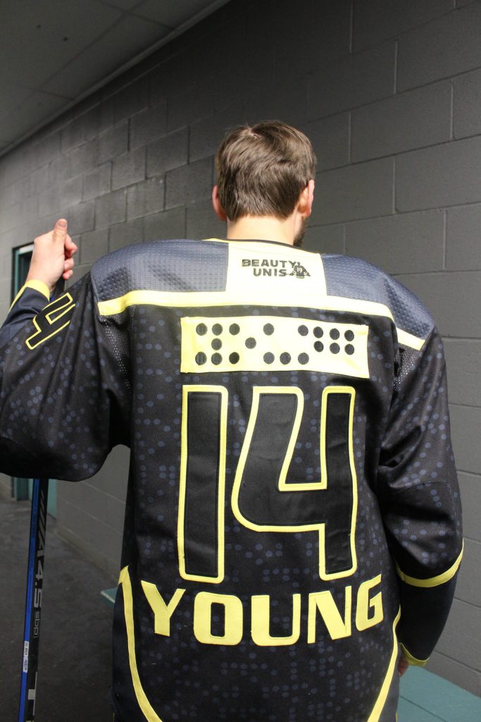 Adam Youngs hockey jersey spells out his name in braille. Photo by Bailey Jo Josie/Sound Publishing