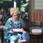 Sylvia receives a homemade card from one of the kids at Drag Queen Storytime. Photo by Bailey Jo Josie/Sound Publishing.