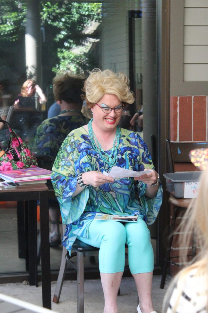 Sylvia smiles after receiving a card from a boy that attended Drag Queen Storytime. Photo by Bailey Jo Josie/Sound Publishing.