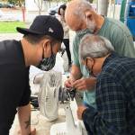 Volunteer fixers attempt to repair a fan at one of King countys 2021 repair events. Photo courtesy of King County Solid Waste Division.
