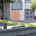 Hours after the early morning crash, plywood had covered the site of the crash and caution tape bordered the front of Hazen High School. Photo by Bailey Jo Josie/Sound Publishing.